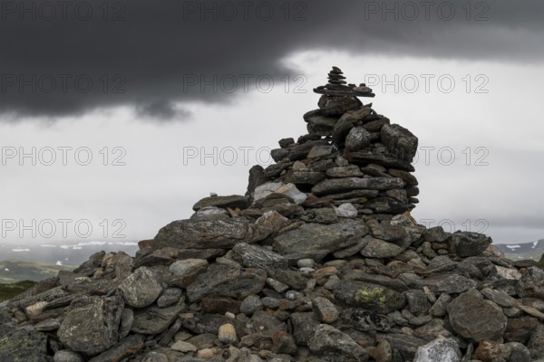 Stones deposited by pilgrims, stone pyramid, Allmannrøysa, Olav's Way or Olavsleden, old Kongevegen or King's Path over Dovrefjell, Norway