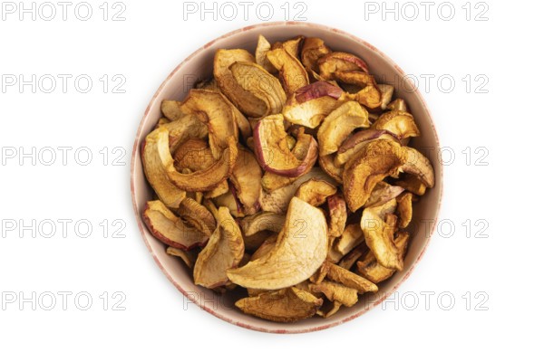 Dried Apples in ceramic bowl isolated on white background. Top view, close up, flat lay. healthy food, minimalism. sweet