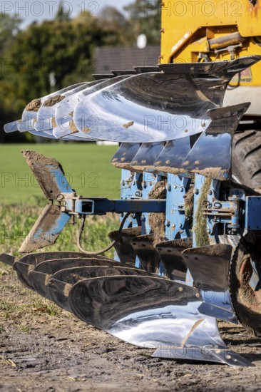 Plough, for ploughing a field, field, ploughshares, agricultural technology, shiny stainless steel, North Rhine-Westphalia, Germany