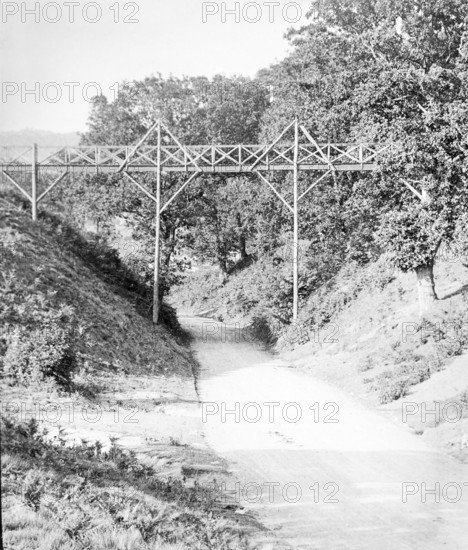 Magic lantern slide of footbridge crossing the road at Wilford Hollows, Bromeswell, Suffolk, England, UK c 1910