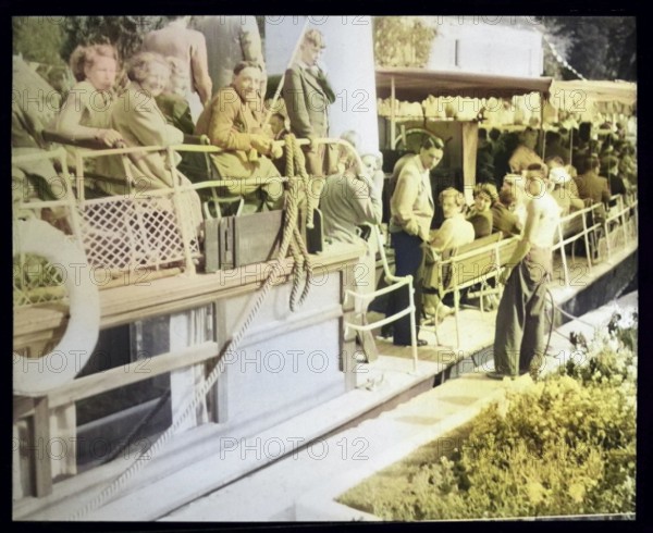 People sitting aboard River Thames steam packet ferry boat either SL Streatley of SS Nuneham, London, England, UK 1920s 0r 1930s colourised