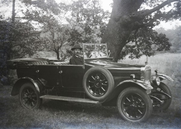Vintage Sunbeam motor car with driver at wheel in rural setting, England, UK 1920s or 1930s