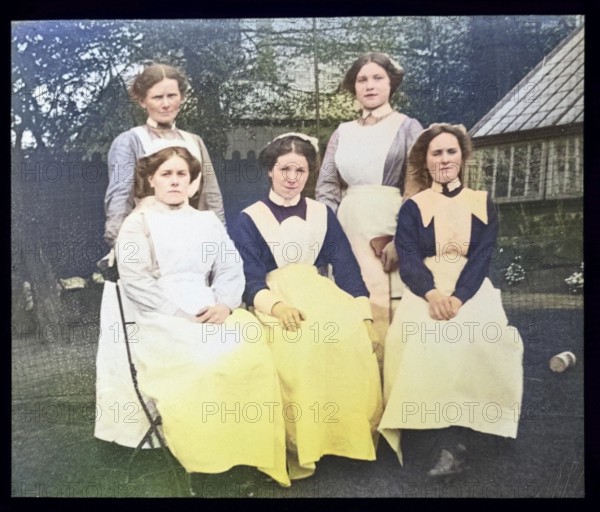 Group portrait of female domestic staff nursemaids servants, British social history c 1900, 1910s, 1920s, 1930s colourised