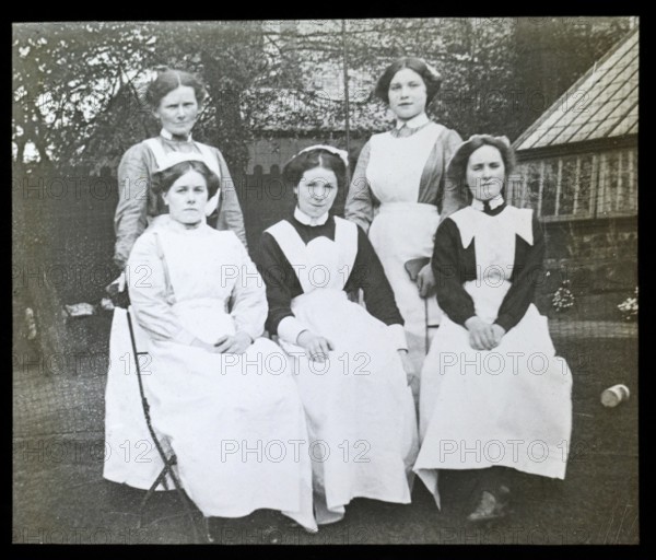 Group portrait of female domestic staff nursemaids servants, British social history c 1900, 1910s, 1920s, 1930s