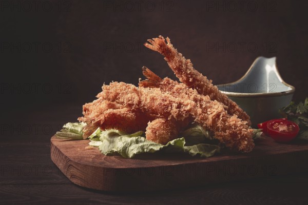 Fried shrimp, peeled in tempura, soy sauce, close-up