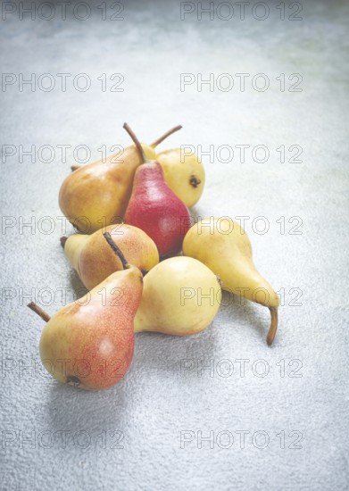 Small pears, Duchess variety, scattered on the table, top view, no people