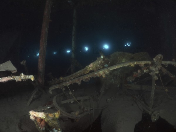 Weathered remains of a wreck under water, overgrown with algae, mysterious darkness. Dive site wreck of the Vis, Pula, Croatia, Mediterranean Sea