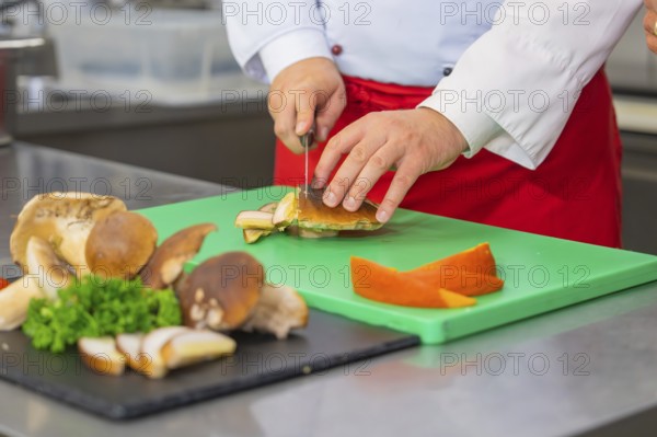 Preparing mushrooms on a chopping board in the kitchen