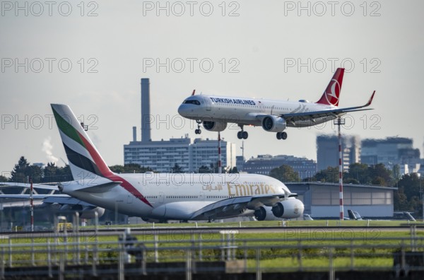 Turkish Airlines Airbus A321neo lands at Düsseldorf Airport, Emirates Airbus A380 taxis for take-off, North Rhine-Westphalia, Germany