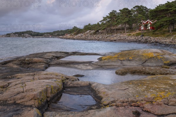Falun red or Swedish red boathouses, Bohus granite, Resö island, Bohuslän, Skagerrak, Sotenäs, Västra Götalands län, Sweden