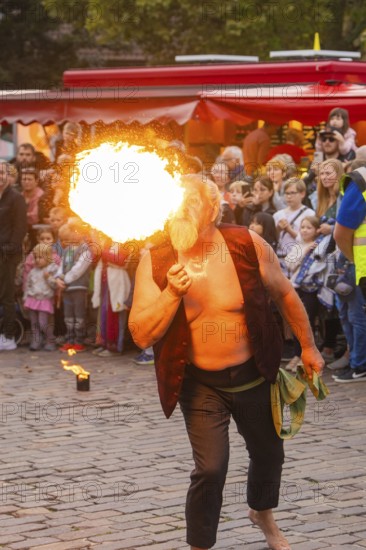 A fire artist spits impressive flames in front of a tense audience, Feuernacht, Sindelfingen, Germany