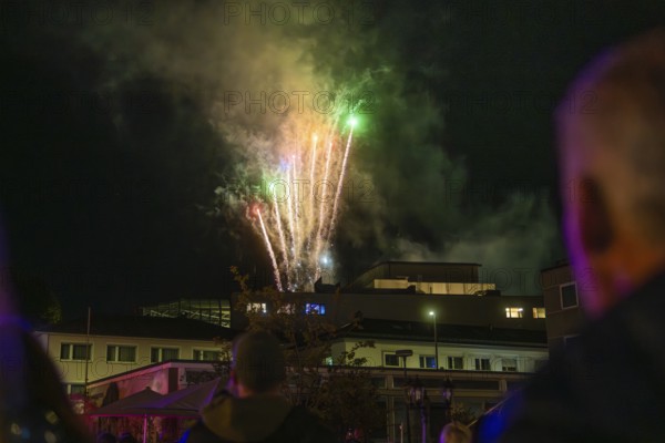 A colourful fireworks display lights up the night, watched by enthusiastic spectators, Fire Night, Sindelfingen, Germany