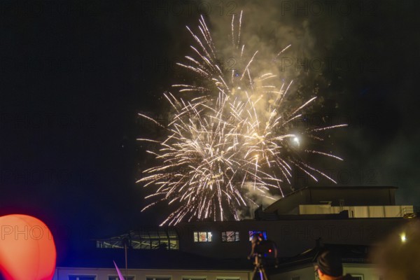 Fireworks illuminate the night sky above a building, atmospheric lights, Fire Night, Sindelfingen, Germany