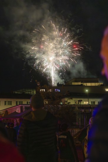 Spectacular fireworks illuminate the night sky during a celebration, people watch fascinated, Fire Night, Sindelfingen, Germany