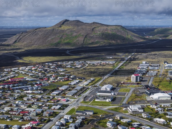 Lava, lava field, village, houses, summer, cloudy, sunny, aerial view Grindavik, Sundhnúkur crater series, Fagradalsfjall, Reykjanes, Iceland