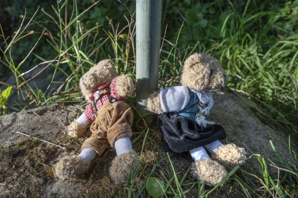 Two abandoned teddy bears on the roadside, Bavaria, Germany
