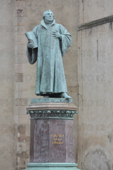 Luther monument, Martin Luther with Bible, sculpture, verdigris inscription, monument, Magdeburg, Saxony-Anhalt, Germany
