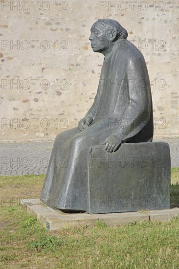 Sculpture Käthe Kollwitz by Gustav Seitz 2010, monument to the paintress, sculptor, seated female figure, bronze sculpture, modern art life-size, sculpture park, Magdeburg, Saxony-Anhalt, Germany
