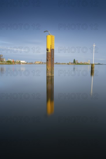 View of a steel dolphin standing in the Weser, long exposure, Bremen, Germany