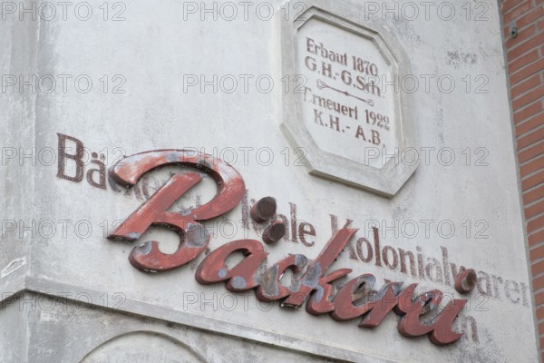 Façade lettering of an old bakery that was applied over even older lettering, Barrien, Syke, Diepholz, Lower Saxony