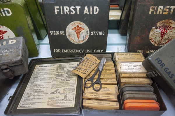 WW2 American first aid kits showing bandages, dressings and safety pins in metal boxes of the US Army, used during World War Two