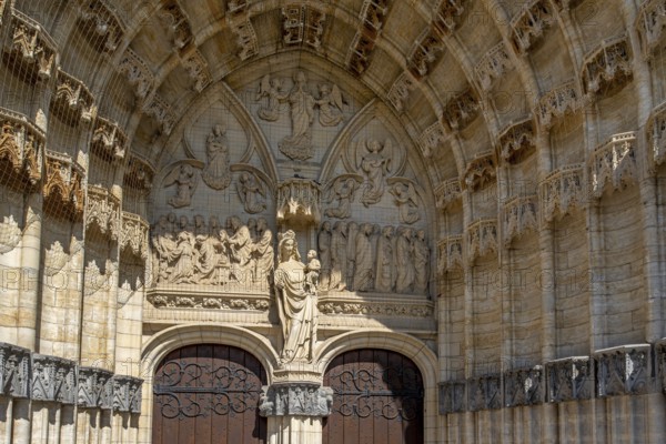 Portal of 14th century Onze-Lieve-Vrouw-ten-Poelkerk, Gothic church of Our Lady ten Poel in the city Tienen, Tirlemont, Flemish Brabant, Belgium