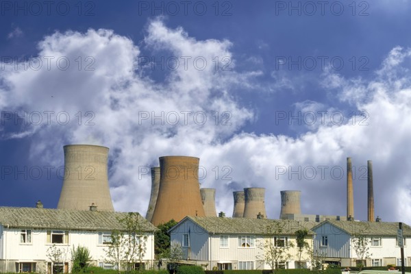 Cooling towers of a coal-fired power station next to a residential neighbourhood, Midlands, England, Great Britain