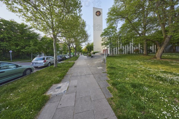Ev. Stephanuskirche Weilimdorf gable, church, modern architecture, architect Wilhelm Tiedje, church tower, tower clock, pavement, parking lane with vehicles, trees, lawn, evening light, blue sky, cloudless, Giebelstraße, Stuttgart, state capital, city district Stuttgart, Baden-Württemberg, Germany