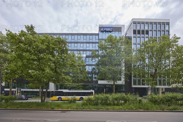 Auditing and management consultancy KPMG, modern architecture, street, public bus, trees, milky blue sky, diffuse light, Theodor-Heuss-Straße, Stuttgart, state capital, urban district of Stuttgart, Baden-Württemberg, Germany