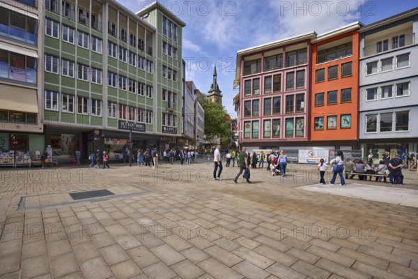 Square, general architecture, pavement slabs, trees, steeple of the collegiate church Stuttgart, retail shops, shopping, pedestrians as accessories, blue sky, cumulus clouds, cirrostratus clouds, intersection Kirchstraße with Kirchstraße, Stuttgart, state capital, city district Stuttgart, Baden-Württemberg, Germany
