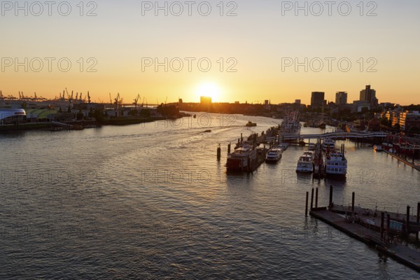 Hamburg harbour, view from the Elbphilharmonie over the Elbe at sunset, jetty, cranes of the container port on the horizon, Hamburg, Germany