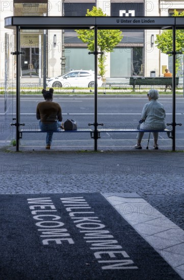 Glass bus shelter at a bus stop Unter den Linden, Berlin, Germany