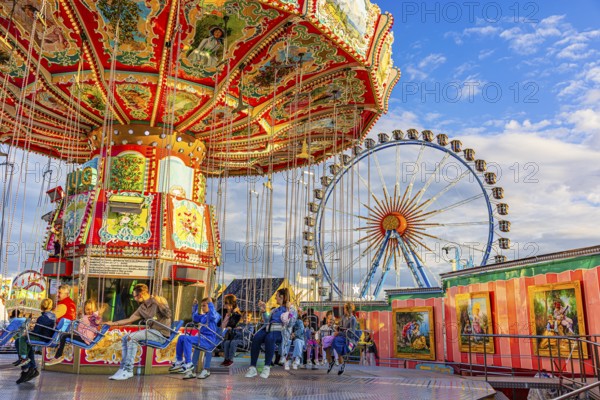 Chain carousel at a standstill, Ferris wheel in the background, Theresienwiese, Oktoberfest, Munich, Upper Bavaria, Bavaria, Germany