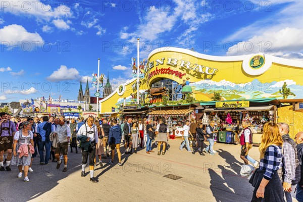 Visitors on the festival meadow in front of the Ochsenbraterei marquee, St Paul's Church in the background, Theresienwiese, Oktoberfest, Munich, Upper Bavaria, Bavaria, Germany