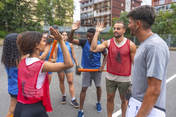 Multi ethnic baseball team giving high fives to their coach after winning a game, celebrating their victory on the field with smiles and enthusiasm