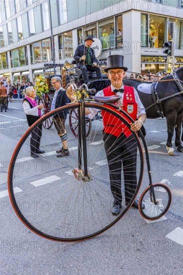 A penny-farthing rider with top hat, Oktoberfest, Munich, Upper Bavaria, Bavaria, Germany