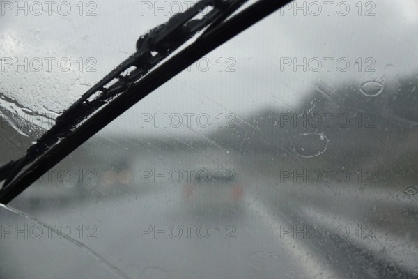 Car journey in rainy weather, summer, Germany