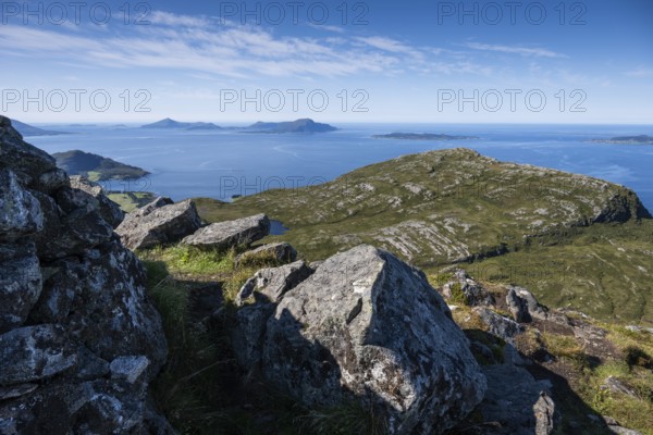 View over rocky mountain and coastal landscape, offshore islands in the background, Otroya or Otrøya, Møre og Romsdal, Norway