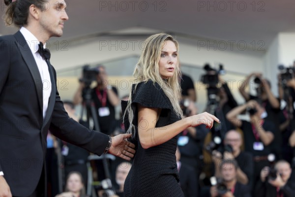 Venice, Italy - 2 September 2025: Rory St. Clair Gainer, Rebecca Ferguson during the Red Carpet of - A house of Dynamite - during the 82nd Venice International Film Festival