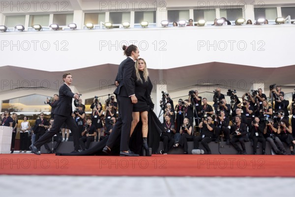 Venice, Italy - 2 September 2025: Rory St. Clair Gainer, Rebecca Ferguson during the Red Carpet of - A house of Dynamite - during the 82nd Venice International Film Festival
