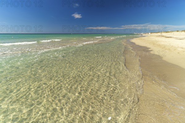 Crystal-clear turquoise water on the beach at Torre San Giovanni, Marina di Ugento, Apulia, Italy