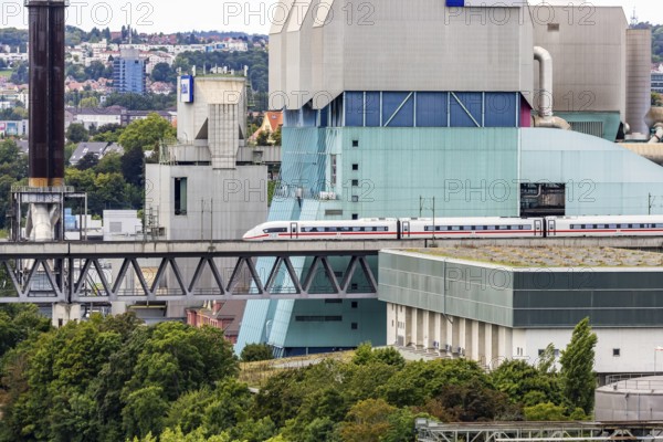 Deutsche Bahn AG ICE en route on the Schuster railway near Stuttgart. Stuttgart-Münster railway viaduct with combined heat and power plant of EnBW, Energie Baden-Württemberg. Stuttgart, Baden-Württemberg, Germany