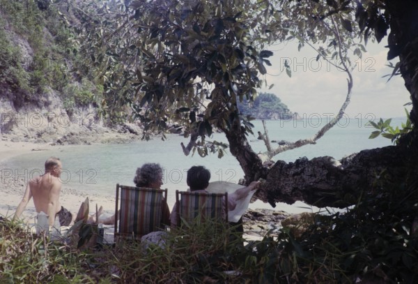 British expatriates enjoying leisure time in coastal bay sandy beach, photos of Singapore and Johor Malaysia, south east Asia 1965