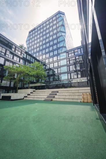 Inner courtyard with modern architecture and glass façade, urban design, Munich, Germany