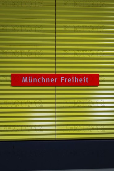 Sign with the inscription 'Münchner Freiheit' against a yellow background, Munich, Germany