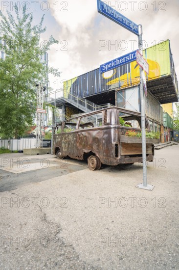 Industrial area with old, planted bus and container buildings in the background, Werksviertel Munich, Munich, Germany