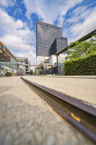 Urban scene with low view of railway tracks and modern buildings, Werksviertel Munich, Munich, Germany