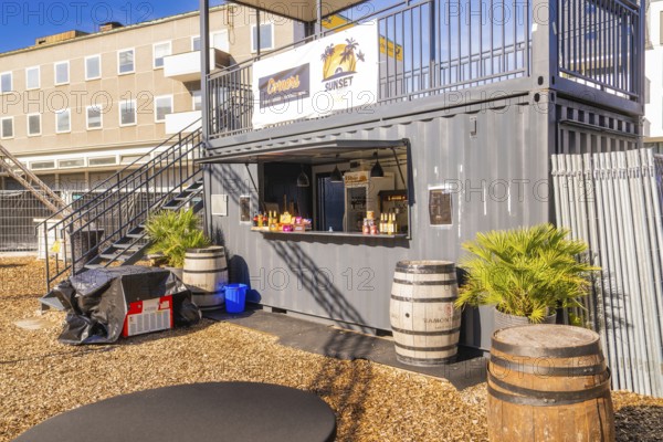 A snack container with barrels and plants outside in the sunshine, open air cinema Sindelfingen, district of böblingen, Germany