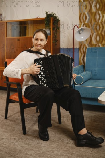 A middle-aged woman is seated comfortably in a vintage living room, skillfully playing the accordion