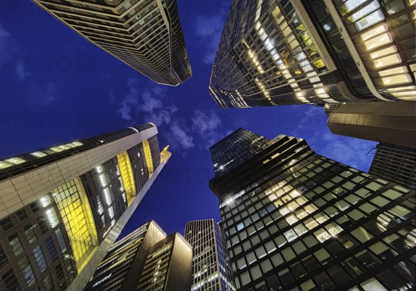 Frog's-eye view of skyscrapers in the banking district in the evening, Four Frankfurt, Frankfurt am Main, Hesse, Germany